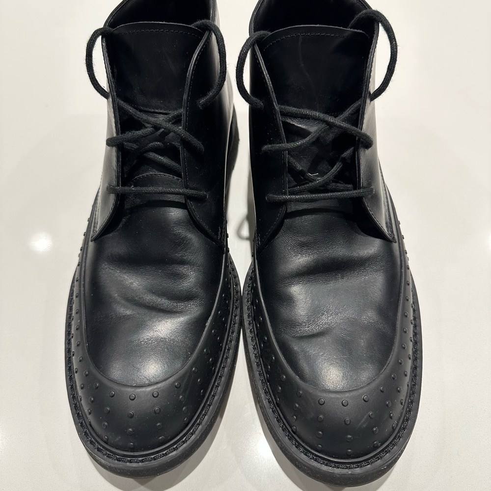 Like new Tod’s black leather boots.